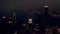 Tower, city buildings and night with drone, ocean and property in urban area, dark and new york. Coastal, architecture