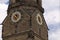 Tower clock on Stiftskirche church bell tower in Stuttgart in Germany
