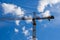 Tower crane, clouds, and blue sky