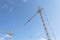 Tower crane at a construction site. Lifting heavy loads