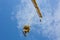 Tower Crane with hook shot from below against blue sky