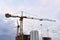 Tower cranes in action at construction site. Construction of skeleton of new modern residential buildings. Preparing to pour of