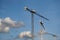 Tower cranes on background cloudy sky