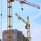 Tower Cranes Image with Blue Sky - Stock Pictures