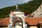 tower with cross and serbian flags