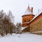 Tower and defensive wall of historical Trakai castle covered with snow, Lithuania. Winter landscape