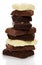 Tower of different pieces porous milk and black chocolate isolated.