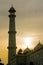 Tower and domes of the Taj Mahal shot at sunset