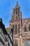 Tower of famous Strasbourg Cathedral in France in romanesque and gothic architecture style with traditional half timbered frame ho