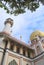 the tower and golden dome of the landmark building of the Sultan Mosque in Muscat Street at Kampong Glam in Singapore