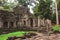 Tower, huge trees and galleries in Preah Khan Temple