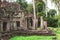 Tower, huge trees and galleries in Preah Khan Temple