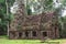 Tower, huge trees and galleries in Preah Khan Temple