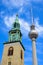 The tower of Marienkirche and Fernsehturm TV Tower at Alexanderplatz in Berlin