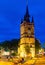 Tower of medieval belfry in historical city centre of Kortrijk at night. Belgium