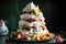 a tower of meringues, stacked high with macerated fruit in between