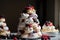 a tower of meringues, topped with berries and cream