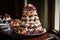 a tower of meringues, topped with berries and cream