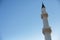 Tower of a mosque against a clear sky
