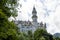 Tower of Neuschwanstein castle in bavaria, germany cloudy mood mountain