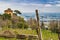 Tower overlooking leafless vineyards in rows