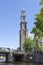 Tower of the Protestant Church of Westerkerk on the banks of the canal in Amsterdam