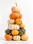 Tower of pumpkins on white background. AI generative