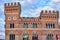 Tower of a renaissance brick building in the city of Grosseto