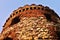 Tower ruins of the mill Windsor with two windows appearing like eyes at sunset in Ceske stredohori region near the village