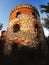 Tower ruins of the mill Windsor with two windows appearing like eyes at sunset in Ceske stredohori region near the village