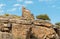 Tower ruins with Omani flag into the hills of the old village Misfat Al Abriyeen  Sultanate of Oman