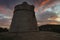 The tower of Sa Sal Rossa in Ibiza at sunrise