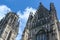 Tower and side gable of the St. Salvator Church in Duisburg, the Gothic basilica is today a Protestant city church, blue sky with