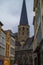 Tower of St. James` Church Sint-Jacobskerk between typical colorful buildings in Ghent, Belgium, Europe