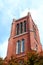 Tower of St. Mary`s Catholic church in Kitchener, Ontario with trees in front