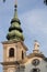 Tower of Stiftskirche Church on Mariahilfer Strasse Street in Vienna in Austria. Cathedral archtecture in Wien. Basilica Building