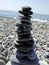 The tower stones at the shingle beach sea background