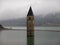 Tower of sunken church in Resia lake