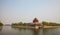 Tower surrounded by moat with water in Beijing