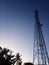 Tower telecommunication at the night with the moon in Indonesian country