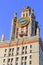 Tower with thermometer of Lomonosov Moscow State University MSU in sunny summer evening on a blue sky background