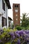 The tower of the village of Pralormo with wisteria