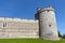 The tower and wall near King Henry VIII Gate of Windsor Castle, royal residence at Windsor in county of Berkshire, England, UK