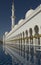 Tower, water pool and arches at the stunning Sheikh Zayed Grand Mosque in Abu Dhabi UAE