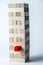The tower of wooden cubes, as a symbol of support, teamwork and business development. Vertical frame