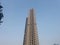 towering buildings blue sky background