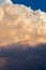 Towering cumulonimbus thunderstorm cloud with blue sky in the ba