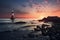 towering lighthouse overlooking calm ocean waves