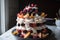 towering meringue dessert with layers of fruit and whipped cream