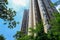 Towering modern buildings in sunny summer sky